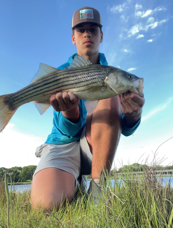 Youth Catch of the Week winner Chris Grelle of Fairhaven, MA with his striped bass