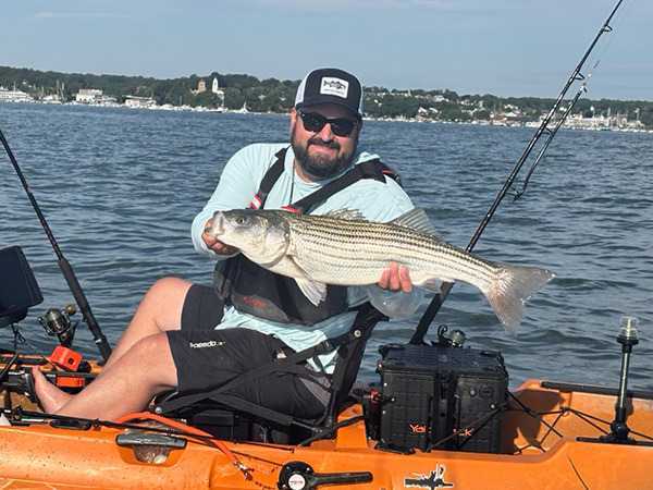 Week 9 Kayak winner Steffen Sostre of Plymouth, MA with his striped bass