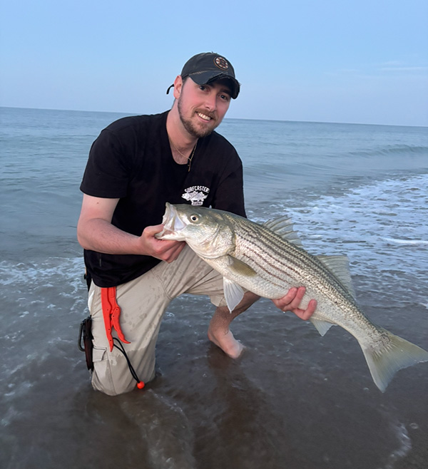 Week 12 Shore winner Jake Elia of Milford, MA with his striped bass