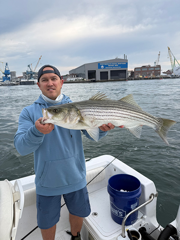 Week 14 Boat winner Christopher Gibbons of Stratham, NH with his striped bass