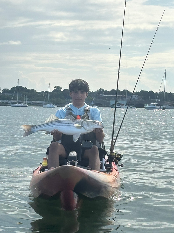 Youth Catch of the Week winner Logan Potter of Lexington, MA with his striped bass