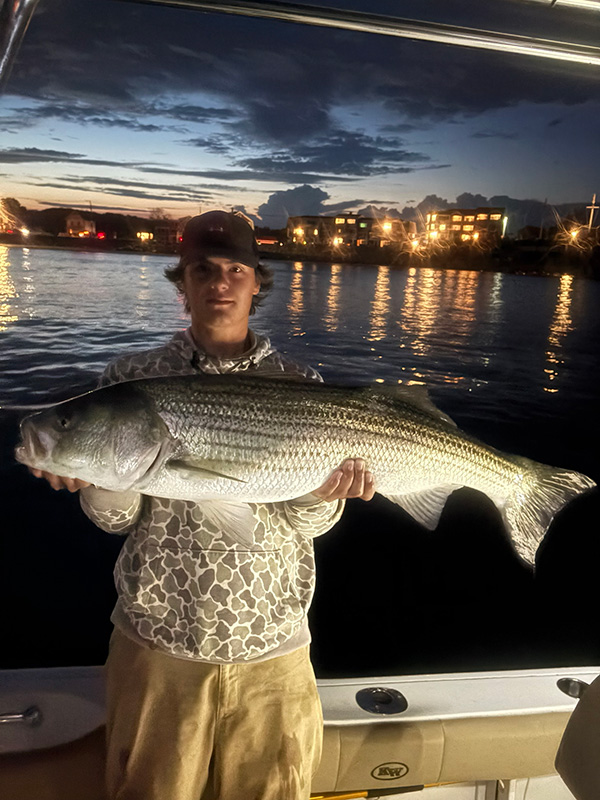 Youth Catch of the Week winner Caz Pendleton of Eliot, ME with their striped bass