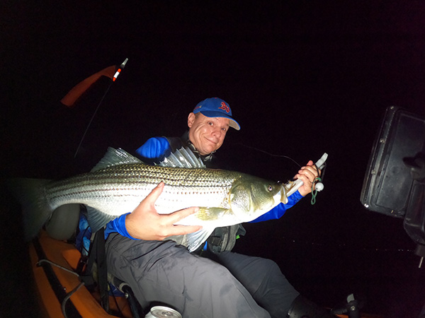 Week 16 Kayak winner Craig Desmarais of Woburn, MA with his striped bass