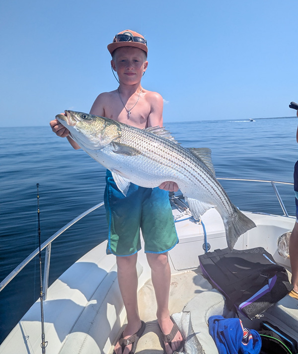 Youth Catch of the Week winner Travis Grier of Pembroke, MA with his striped bass