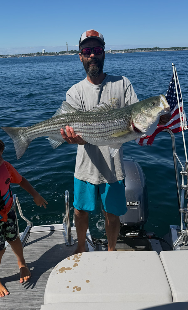 Week 18 SIMRAD Bonus winner Ross Silva of Eastham, MA with his striped bass