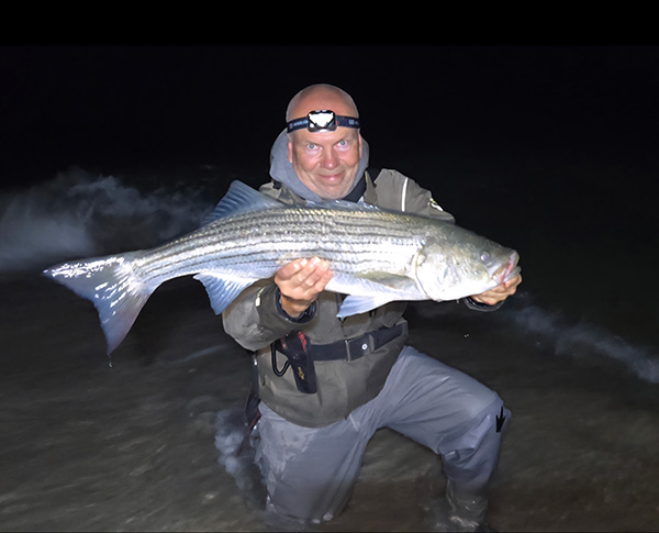 Week 20 Shore winner Christopher Wroblewski of Dennis Port, MA with his striped bass
